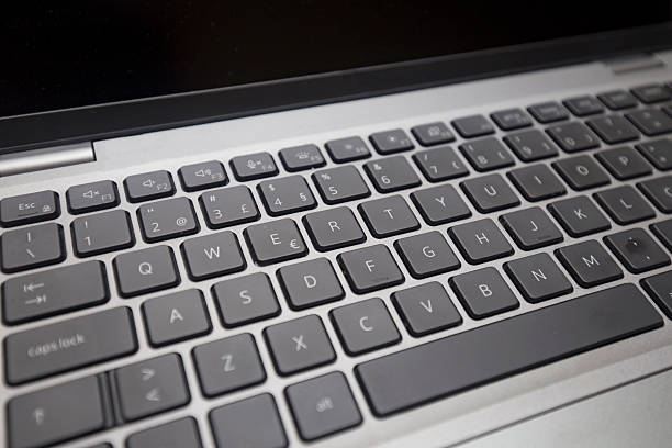 istock Detail of the isolated notebook keyboard. 2243388245