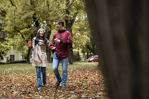 istock Happy Couple Strolling in Autumn Park 2243388713