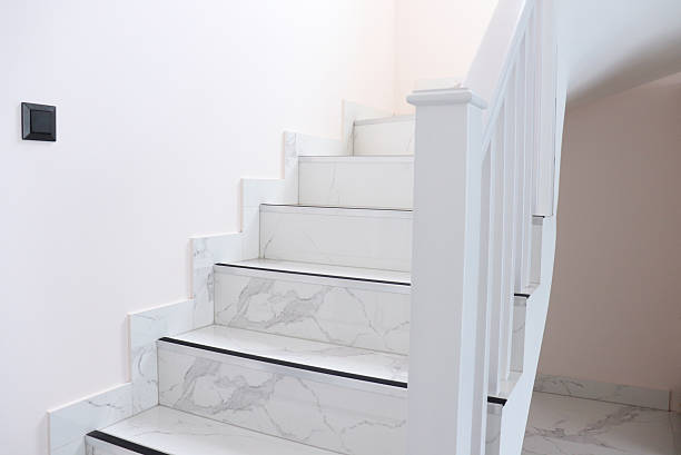 istock Modern marble staircase with white railings and minimalist design in bright interior. 2243388991