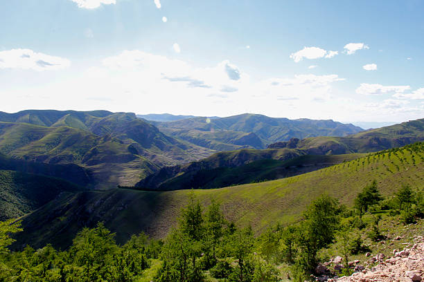 istock Beautiful mountain range with lush green vegetation under a clear sky 2243389042