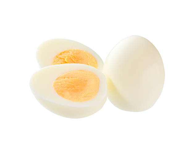 istock Hard boiled chicken eggs and half of egg with yellow yolk  isolated on a white background. 2243389917