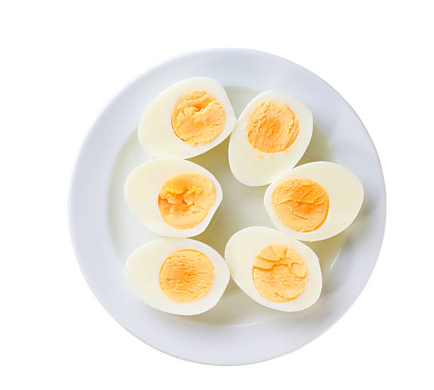istock Boiled chicken eggs in a ceramic plate isolated on a white background, top view. 2243389948