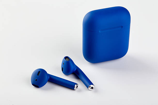 New Blue Wireless headphones AirPods in charging case close-up on white background.