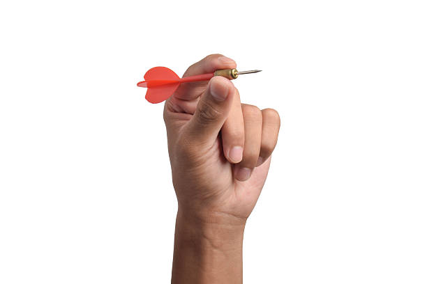 istock Dart in hand on white background 2243392650