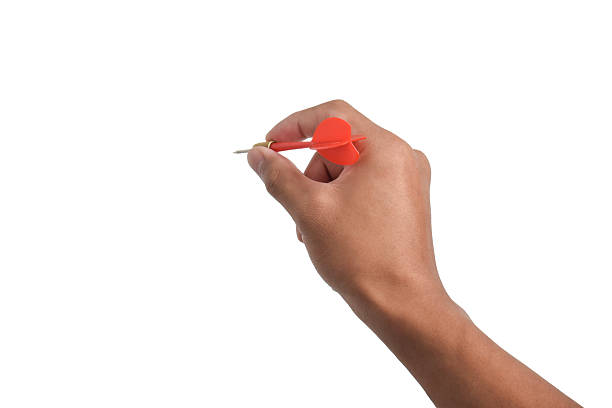 istock Man's hand holding a dart on white background 2243392689