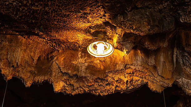 istock A ceiling lighting lamp in rock mine industrial workplace. 2243395699