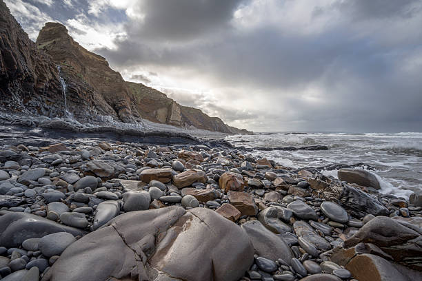 istock Autumn Sandymouth Bay at high tide with storm clouds 2243396645