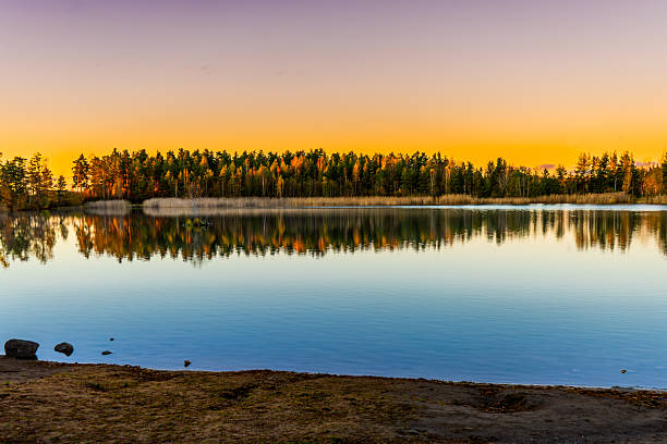 istock Autumn Reflection on Finnish Lake at Golden Hour 2243399680