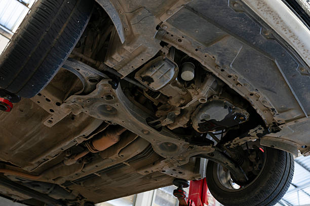 istock Underside of car on lift in auto repair workshop 2243401127