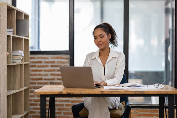 istock Serious businesswoman working in the office. 2243404505