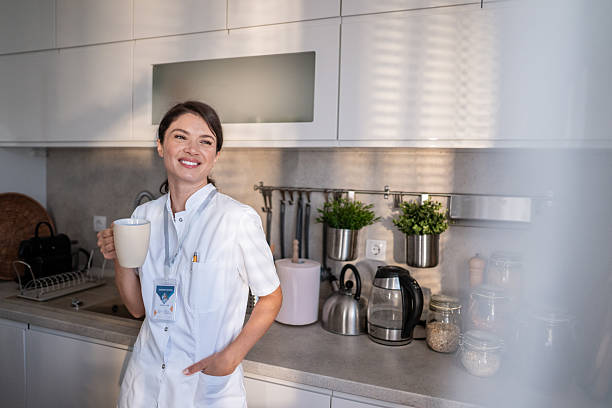 istock Healthcare professional enjoying coffee break in kitchen 2243404815