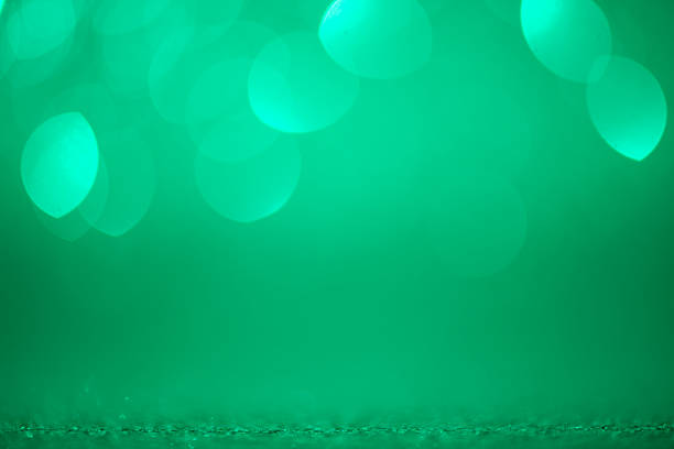 istock A glowing green gradient evokes seasonal wonder. Defocused textures and blurred bubbles glow softly in the light. Perfect for Christmas, valentines, or Anniversary celebrations. 2243407755