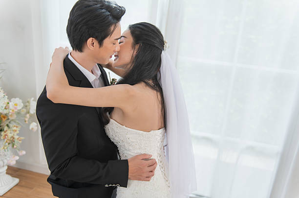 istock Romantic newlywed couple embracing on wedding day 2243410567