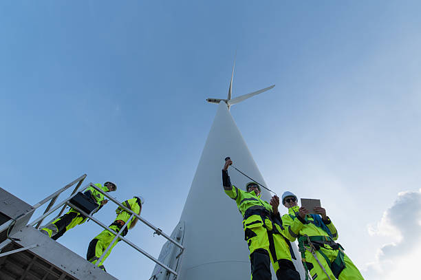 istock Wind Turbine Maintenance and Repair Technician, Engineer Checking Turbines working maintenance clean power generator system 2243410713