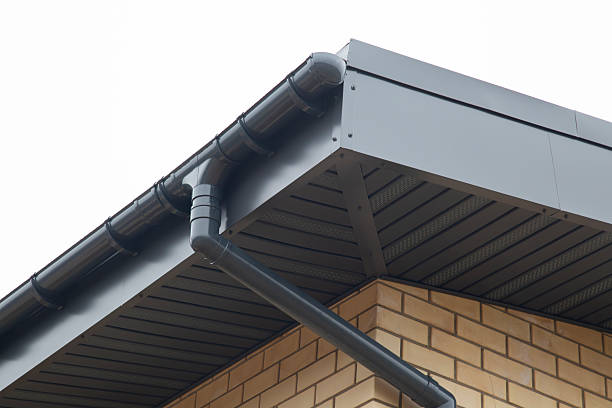istock Modern guttering on a modern roof. Roof drainage. 2243411910
