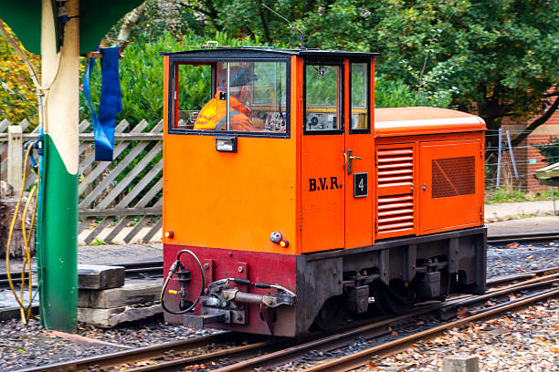 Aylsham, Norfolk, United Kingdom: October 15, 2024: ‘Rusty’, a narrow gauge railway diesel engine which is used for shunting, moving along the track. The 15” Bure Valley Railway runs between Aylsham and Wroxham in Norfolk, Eastern England; it uses steam, electric and diesel engines and stops at Brampton, Buxton and Coltishall on its way to Wroxham in the heart of the Norfolk Broads. The Bure Valley Railway opened in 1990 and has been a popular tourist attraction ever since.