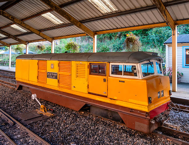 Aylsham, Norfolk, United Kingdom: October 15, 2024: ‘2nd Air Division USAAF’, a narrow gauge railway diesel hydraulic engine, which is used for pulling passenger trains, waiting by the station platform. It was named in honour of the US air force division which flew Liberator bombers from various Norfolk airfields during World War Two. The 15” Bure Valley Railway runs between Aylsham and Wroxham in Norfolk, Eastern England; it uses steam, electric and diesel engines and stops at Brampton, Buxton and Coltishall on its way to Wroxham in the heart of the Norfolk Broads. The Bure Valley Railway opened in 1990 and has been a popular tourist attraction ever since.