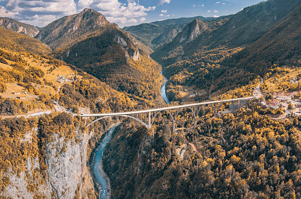 Durdevica Tara Bridge connecting mountainous landscapes and deep canyon with a curving river, showcasing Balkan nature