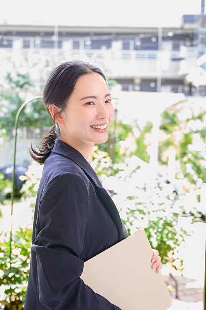 istock A Japanese woman smiling with a computer in the office 2243418153