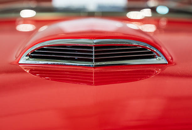Red hood scoop detail on classic Ford Thunderbird.