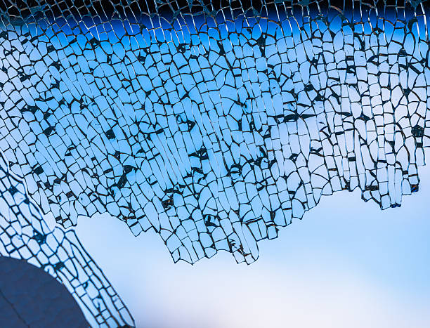 Shattered glass texture and lens flare of the sun