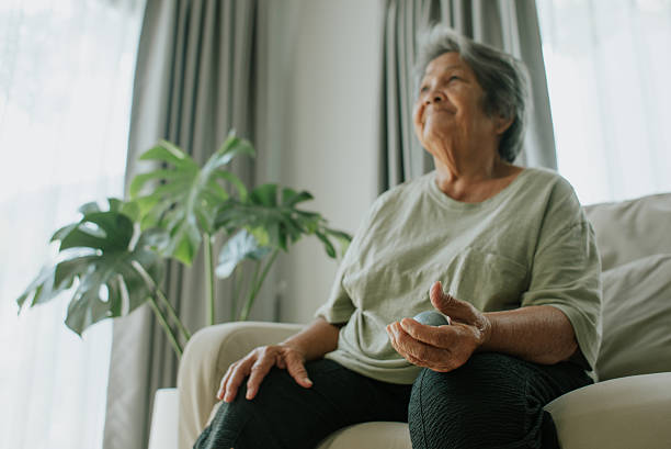 istock Senior woman doing hand exercise at home. 2243422431