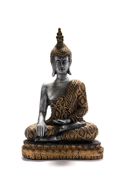 istock Meditating Buddha Statue With Ornate Robe Sits in Peaceful Pose on Decorative Base 2243424520
