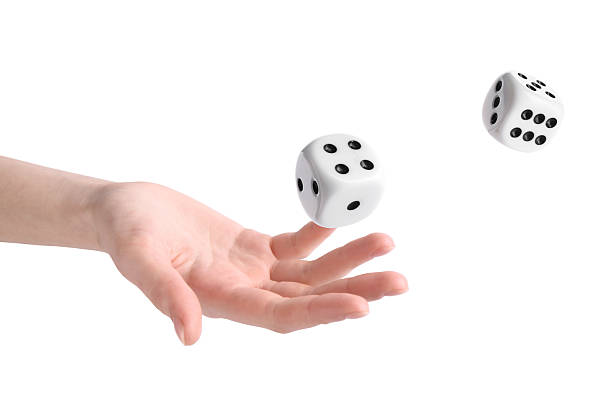 istock Woman throwing dice on white background, closeup 2243429258