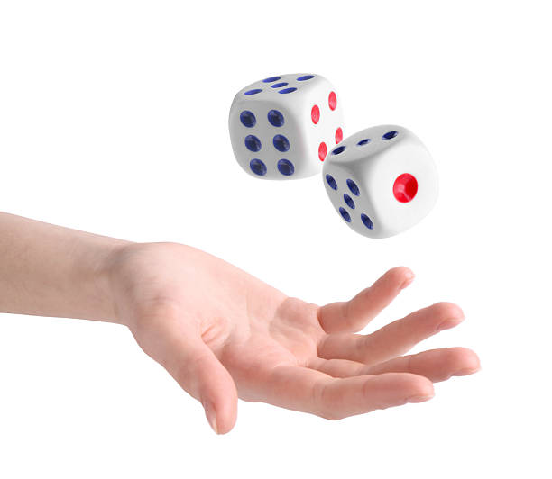 istock Woman throwing dice on white background, closeup 2243429263
