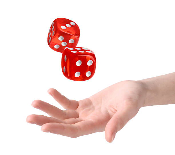 istock Woman throwing red dice on white background, closeup 2243429278