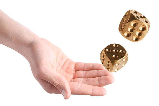 istock Man throwing golden dice on white background, closeup 2243429291