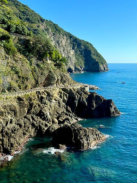 istock Coastal cliffs and turquoise sea along Cinque Terre, Italy 2243432029