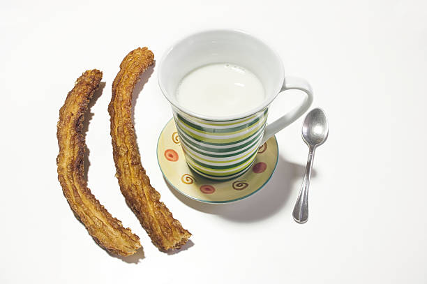 Typical Spanish churros with a cup of milk.