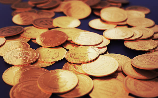 istock Turkish Jewelry Gold Coins on Navy Blue Fabric (Depth Of Field) 2243437979