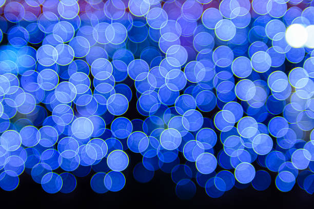 Blue, Red, Purple, White and green light bokeh abstract and blurred background. Colorful and Celebrating concept.