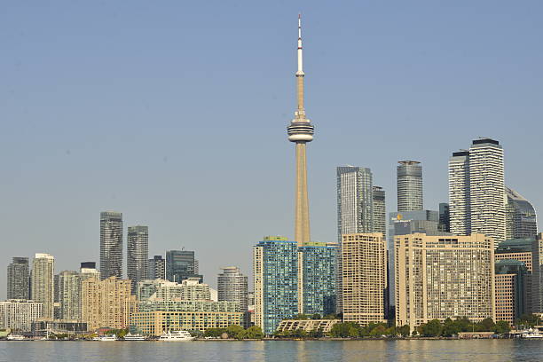 A view of the Toronto skyline from Lake Ontario showing the CN Tower and the Rogers Centre