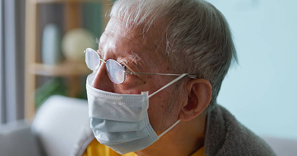 istock Asian elderly wear mask at home 2243450788