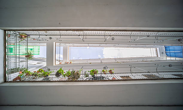 Pasaje Valvanera courtyard features balconies and greenery in Seville