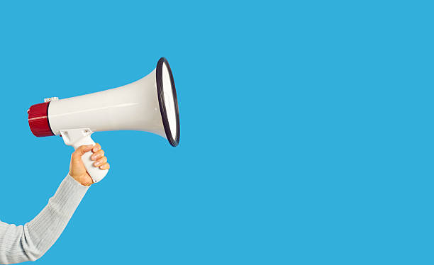 istock Person hold loudspeaker make announcement 2243451764