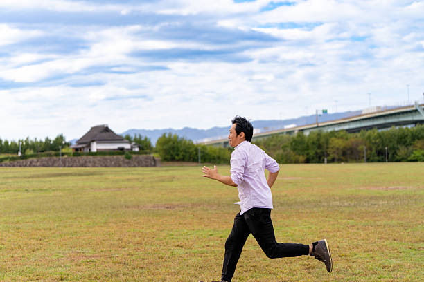 Man Running in an Open Field | Ample Copy Space、Jogging on the Lawn