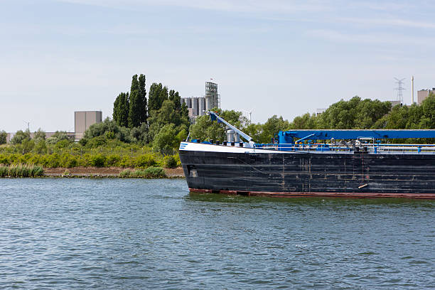 Port of Antwerp - large storage tanks, refinery and ships