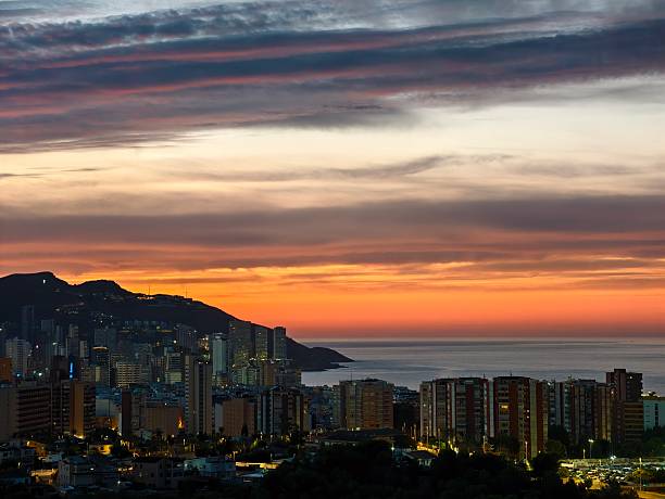 istock vibrant sunset casts colorful reflections across seaside highrise clusters and peaceful harbor 2243454399
