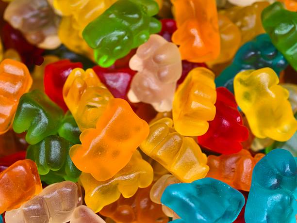 vivid gummy collection, assorted vibrant gummy bears with shiny sugar coating for fun display