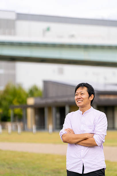 istock Confident Man with Arms Crossed in a Park | Ample Copy Space 2243454715