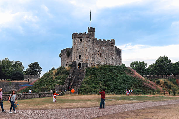 Cardiff, Wales - August 15, 2022: View of Cardiff Castle keep with Welsh flag on top