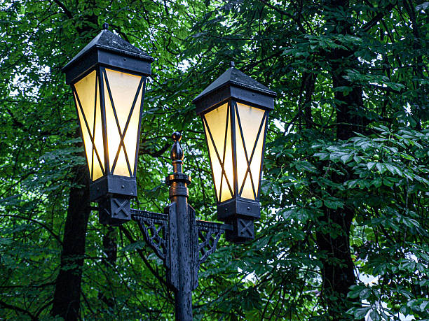 Lanterns in the evening park on a rainy autumn day