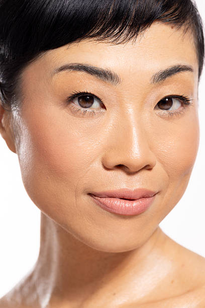 istock Beautiful mature Japanese woman posing against a white background 2243460430