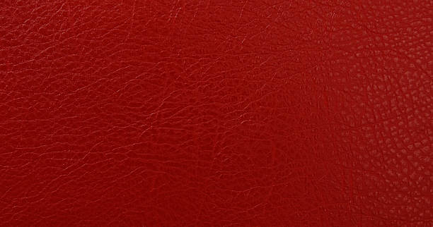 istock Red faux leather material showing textured surface 2243464176