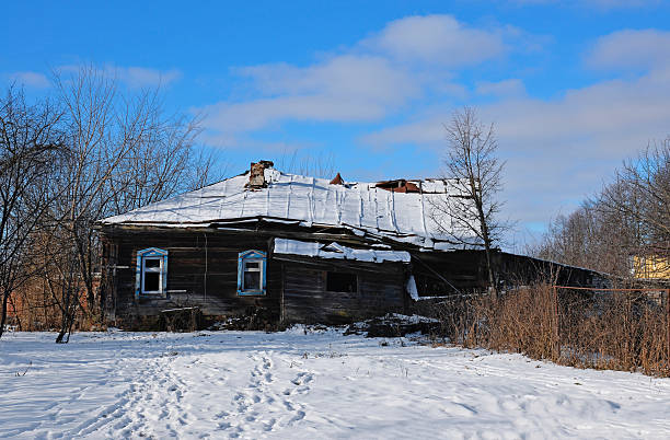 istock Old rickety wooden house in winter 2243464591