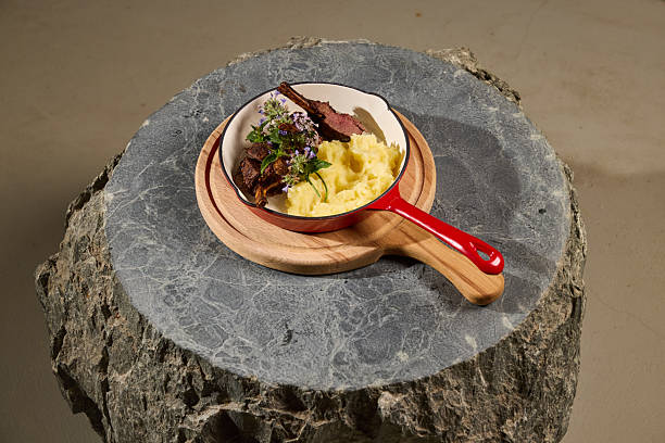 A Gourmet Dish featuring Tender Beef and Creamy Polenta elegantly served with style